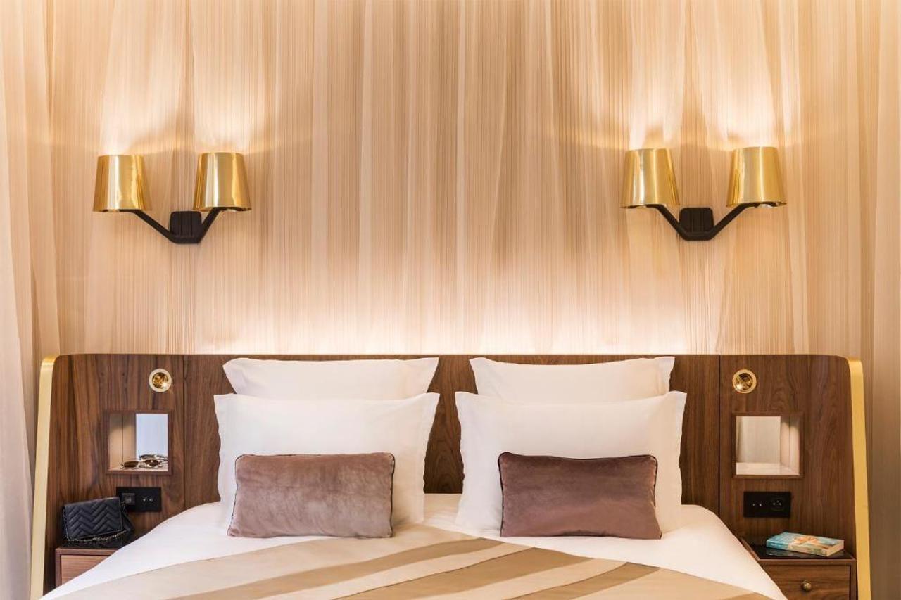 Maison Albar Hotels Le Pont-Neuf Paris Extérieur photo A wall light